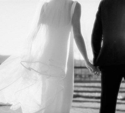 Gentle wife and husband on wedding day picturing marriage