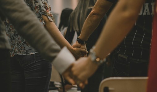 People united in church (holding hands)
