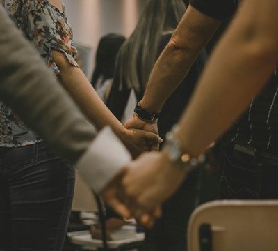 People united in church (holding hands)